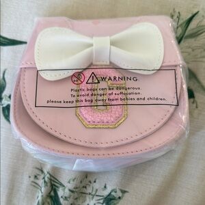 Minnie bow purse with letter “G”